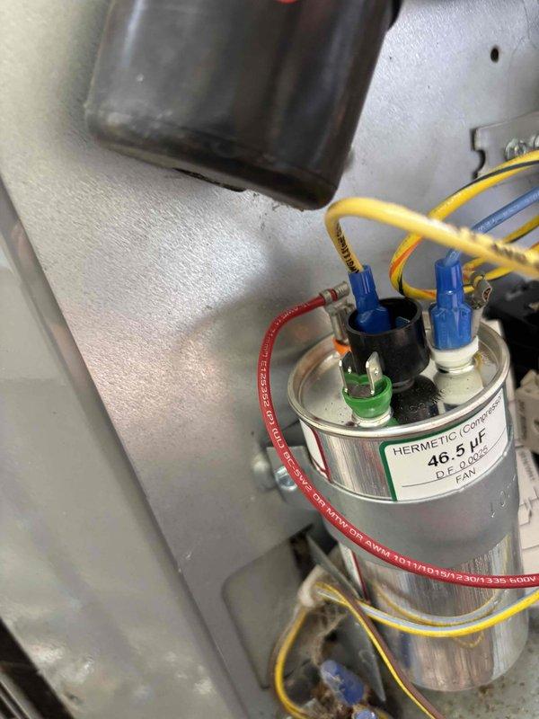 Responded to service call for 13-year-old Carrier system with motor humming when unit was off. Upon inspection, identified faulty contactor causing the humming issue due to stuck contacts maintaining partial circuit engagement even in the off position. Accessed exterior electrical control panel and inspected internal wiring and components. Found 46.5 UF hermetic capacitor and associated electrical connections in serviceable condition. Addressed contactor malfunction by inspecting relay contacts and wiring connections, ensuring proper system shutdown when thermostat calls are not active. Verified all wire terminations were secure and properly routed. Tested system operation to confirm motor no longer hums during off cycle and unit responds correctly to thermostat commands. System restored to normal operating condition with proper on/off functionality.