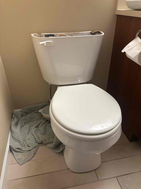 Responded to follow-up service call for ongoing toilet leak. Removed tank lid and inspected internal flush mechanism components. Found deteriorated flapper valve and excessive mineral buildup throughout tank interior causing improper seal. Replaced faulty flapper, cleaned flush valve seat, and tested fill valve operation to ensure proper water shutoff and eliminate persistent leak.
