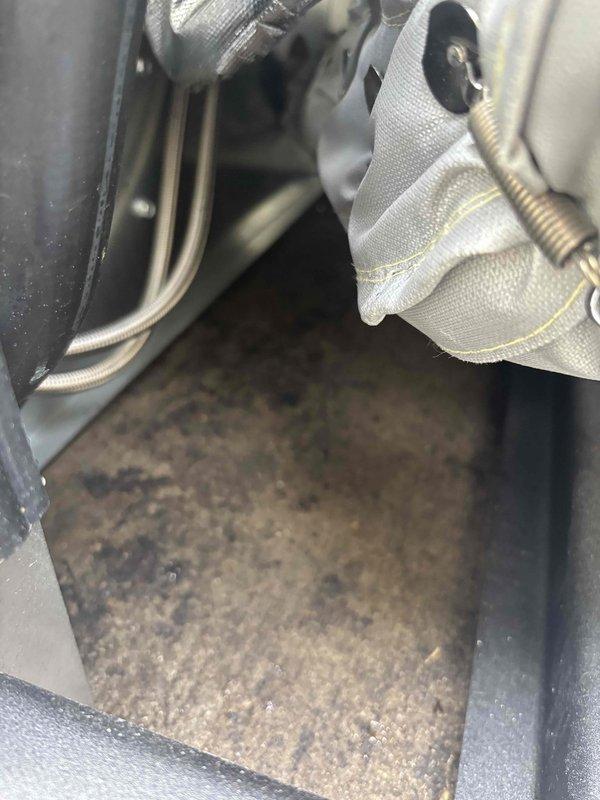 Delivered generator key to customer and performed inspection for oil leaks on mechanical equipment. Upon visual examination of interior compartments, found no evidence of active oil leakage; however, documented significant dust and debris accumulation on base surfaces and interior components requiring future cleaning attention.