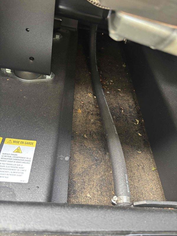 Delivered generator key to customer and performed inspection for oil leaks on mechanical equipment. Upon visual examination of interior compartments, found no evidence of active oil leakage; however, documented significant dust and debris accumulation on base surfaces and interior components requiring future cleaning attention.