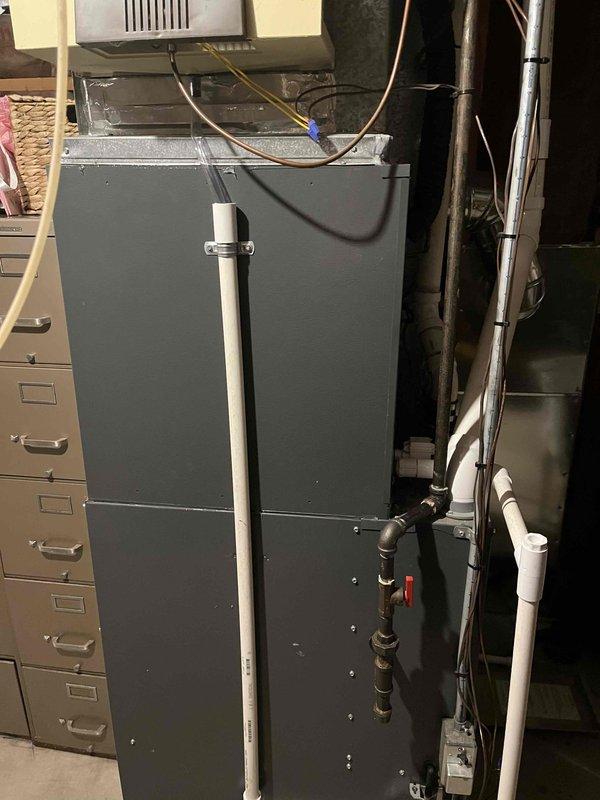 Completed full HVAC system replacement in residential basement mechanical room. Removed existing equipment and installed new Goodman Pinnacle furnace and air conditioning system with associated refrigerant lines, condensate drainage, and electrical connections. Configured PVC venting system with proper pitch and termination, routed copper refrigerant linesets, and established all necessary utility connections. System tested and verified operational upon completion.