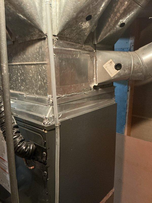 Completed annual cooling system tune-up and preventive maintenance inspection on residential HVAC unit. Performed comprehensive system evaluation including inspection of furnace, ductwork, and condensate pump assembly. Observed rust staining on metal ductwork surfaces and verified proper operation of condensate removal system with white PVC drainage piping. All components inspected and system confirmed operational for cooling season.