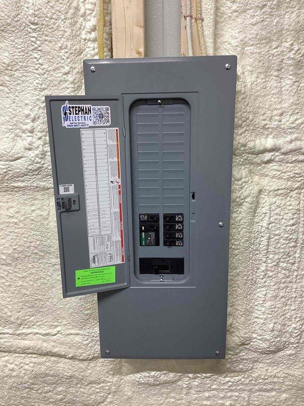 Completed estimate for central air conditioning system and ductless mini-split installation in barn structure. Documented existing electrical infrastructure including main breaker panel with available capacity and spray foam insulated walls to assess equipment placement and installation requirements for proposed HVAC systems.