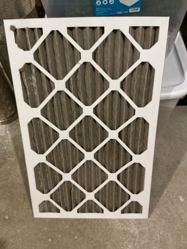Responded to water leak service call and inspected HVAC system with furnace drain pan approximately one-third full of water. Found excessive condensation accumulation on air handler unit and surrounding components, indicating active moisture issues. Documented conditions with photographs showing heavy condensation on metal surfaces, wet insulation pad beneath equipment, and moisture on refrigerant lines. Verified air filter condition and system configuration. Unit is covered under warranty through December 2033.