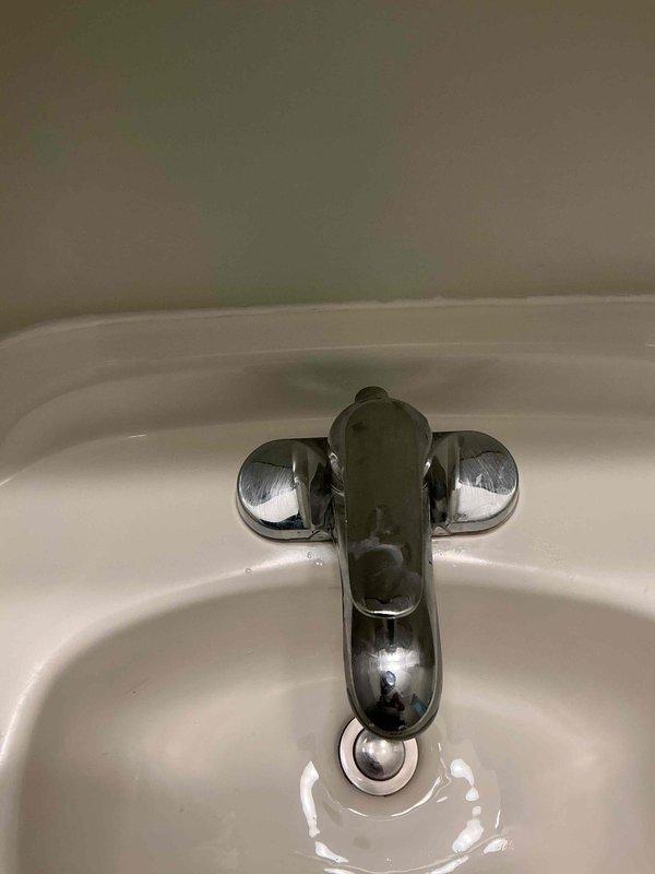 Responded to plumbing leak concern with water surfacing in basement, suspected to be related to previous tree root intrusion in main sewer line. Installed decorative escutcheons on bathroom fixtures including bathtub spout, shower diverter valve, and temperature control handles to provide finished appearance and proper wall sealing. All fixtures photographed and verified for proper installation and functionality.