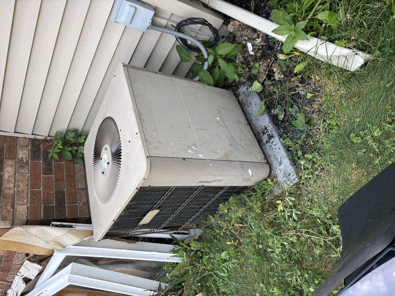 Responded to no-cool condition on 20-year-old central air conditioning system serving single-family residence. Upon arrival, confirmed outdoor condenser unit was attempting to start but failing to run, producing noise during start-up attempts with no cooling output. Performed diagnostic assessment of both indoor air handler and outdoor condensing unit, documented equipment age and condition through photographic documentation, and identified system failure preventing compressor operation. Due to advanced age of equipment and nature of mechanical failure, provided customer with repair versus replacement options and recommendations for restoring cooling capacity to the home.