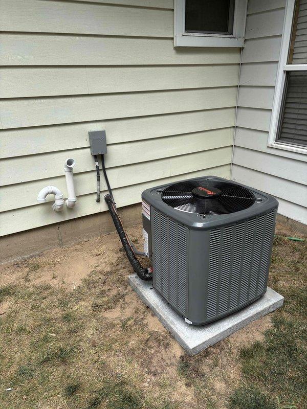 Completed full HVAC system installation including new furnace and outdoor air conditioning condenser unit. Verified and confirmed proper tonnage match between outdoor condenser, indoor coil, and home heating/cooling requirements per customer request. Installed furnace in basement mechanical room with proper PVC venting, drain pan, and clearances; mounted outdoor condenser unit on concrete pad with electrical disconnect, refrigerant line set, and condensate drainage system properly configured. All equipment tested and operational upon completion.
