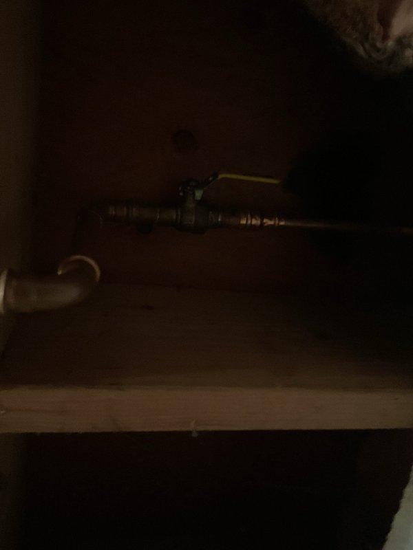 Removed existing pressure vacuum breaker assembly from exterior plumbing system and installed new hose bib in its place. Work performed in crawl space area with modifications to existing gas and water line configuration to accommodate the new fixture installation.