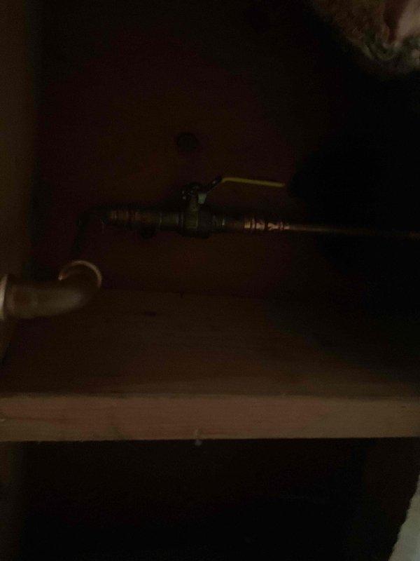 Removed existing pressure vacuum breaker assembly from exterior plumbing system and installed new hose bib in its place. Work performed in crawl space area with modifications to existing gas and water line configuration to accommodate the new fixture installation.