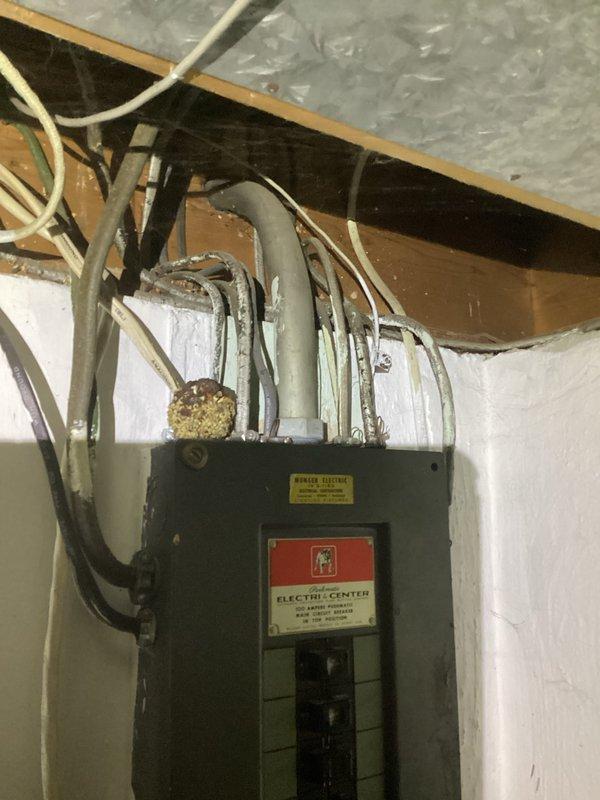 Responded to follow-up diagnostic request for air conditioning system with compressor in thermal overload condition. Upon arrival, documented electrical service panel and basement utility area where compressor unit is located. System requires cooling period before diagnostic testing can be completed to prevent further damage to compressor components. Photos captured of electrical distribution panel, conduit routing, and basement mechanical space configuration for reference during return visit to complete system diagnosis and provide estimate for necessary repairs or replacement.