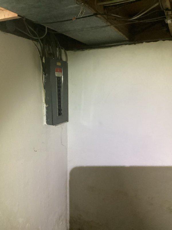 Responded to follow-up diagnostic request for air conditioning system with compressor in thermal overload condition. Upon arrival, documented electrical service panel and basement utility area where compressor unit is located. System requires cooling period before diagnostic testing can be completed to prevent further damage to compressor components. Photos captured of electrical distribution panel, conduit routing, and basement mechanical space configuration for reference during return visit to complete system diagnosis and provide estimate for necessary repairs or replacement.