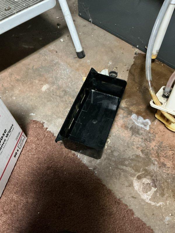 Completed annual cooling maintenance on EnergiAir system with 2022 condenser. Performed comprehensive tune-up including system inspection, refrigerant level check, electrical connection testing, and condenser coil cleaning. Identified excessive moisture accumulation on basement floor near equipment with condensate drain pan in place to collect overflow. Replaced heavily soiled air filter with significant dust and debris buildup that was restricting airflow. Verified proper drainage function, tested system operation across all cooling modes, and confirmed unit is operating within manufacturer specifications. System running efficiently with improved airflow following filter replacement.
