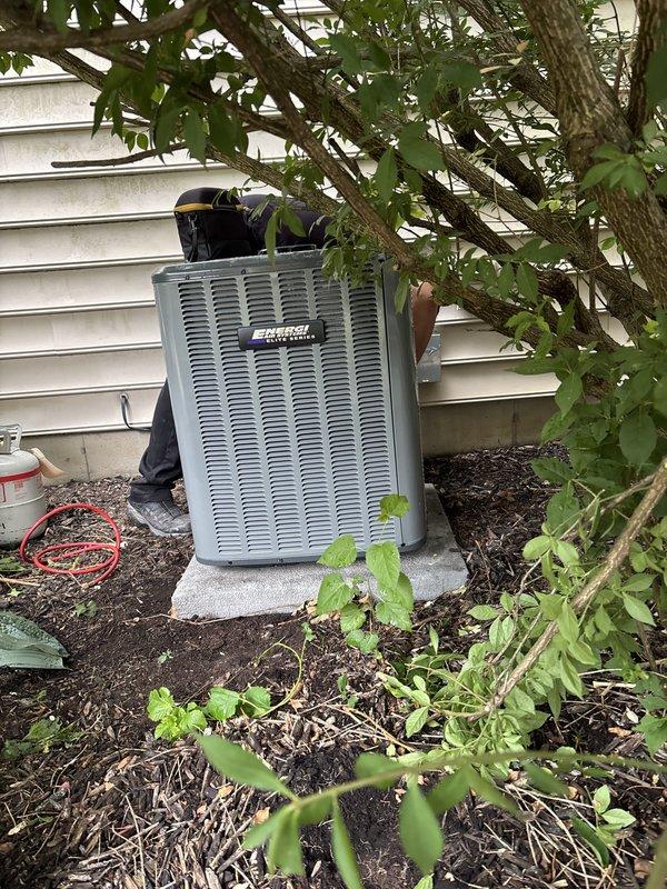 Completed full HVAC system replacement including outdoor condensing unit and indoor air handler. Removed existing equipment and installed new Amana furnace with matching condenser unit on existing concrete pad. Ran new refrigerant lines with proper insulation, installed PVC condensate drainage piping, and completed all electrical connections per manufacturer specifications. Positioned outdoor unit against home exterior with proper clearances, secured indoor components with drain pan protection, and verified all system connections. System tested and operational upon completion.