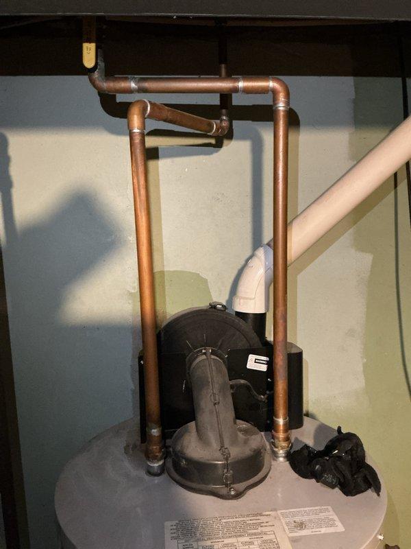 Completed estimate for replacement of existing 11-year-old water heater with new 40-gallon natural gas unit in single family residence. Evaluated current installation including copper supply piping configuration, circulation pump system, and gas connections. Documented existing equipment condition and provided recommendations for new water heater installation with no urgent issues or active leaks present at time of assessment.