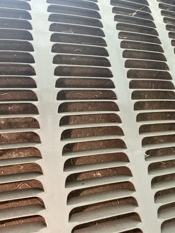 Completed annual cooling system tune-up and inspection on 2017 cooling unit under EnergiAir warranty coverage. Performed comprehensive maintenance including inspection of evaporator coil and ventilation components, documenting condition with photos showing accumulated dust and debris on air vent grilles and copper coil fins. All system components operating within normal parameters upon completion of preventive maintenance service.