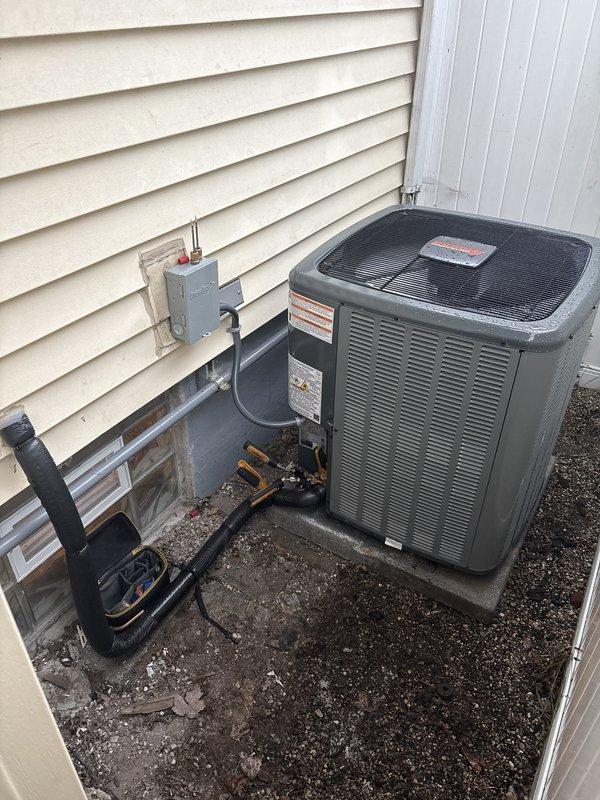 Completed full HVAC system installation including furnace, air conditioning unit, and water heater at residential property. Installed outdoor AC condenser unit on concrete pad with proper electrical disconnect, refrigerant line routing through foundation, and connection to indoor components. Installed new water heater in basement utility area with copper supply piping, pressure relief valve, metallic exhaust venting, and proper wall mounting per manufacturer specifications.