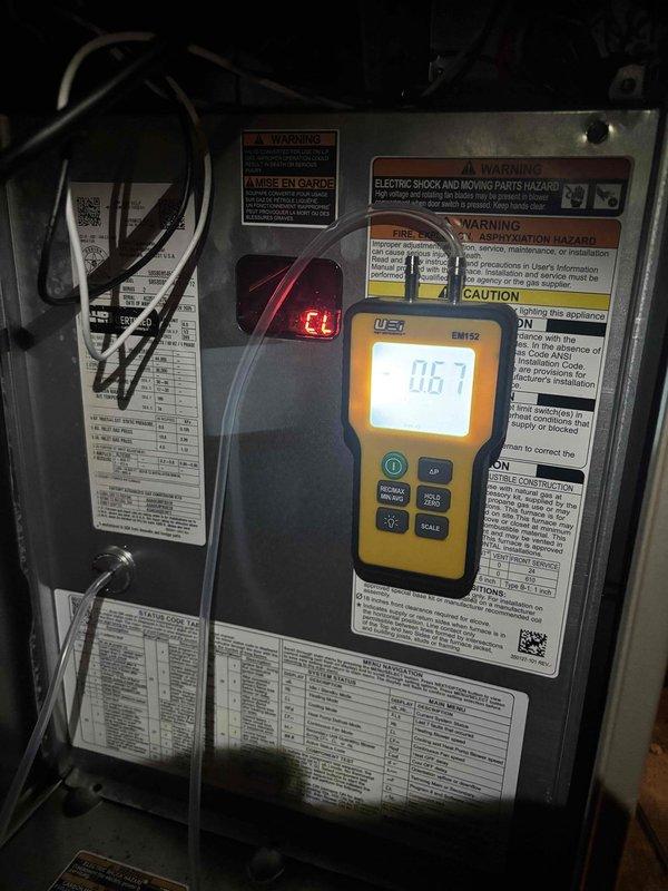 # CP-Cooling Problem Resolution

Responded to no airflow complaint with unit frozen over. Upon arrival, found evaporator coil completely iced, restricting all airflow to living space. Verified blower motor operation and measured amp draw at 0.67A and 0.10A under different conditions using digital meter, confirming motor functionality within acceptable range. 

Identified frozen coil as primary issue preventing air circulation. Shut down system to allow complete defrost of evaporator coil. Inspected air filter, ductwork accessibility, and blower compartment for restrictions or maintenance concerns. Monitored system components during diagnostic process to determine root cause of freeze condition. Documented equipment readings and conditions with photos for service records. Unit is 0 years old Carrier model with warranty expiration July 2027. Advised on proper system operation and maintenance to prevent future freeze-ups.