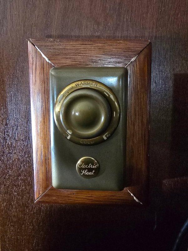 Completed annual cooling maintenance on 3-year-old Carrier unit under warranty through September 2027. Inspected system components, verified proper operation, and documented existing vintage thermostat and electric baseboard heating system with photos for service records.