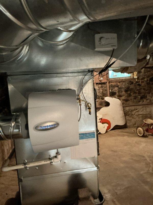Responded to an early availability request to complete water line connection following humidifier installation. Connected the water supply line from existing plumbing to the newly installed AprilAire humidifier unit mounted on the main ductwork system in the basement utility area. Verified proper water flow and system operation upon completion.