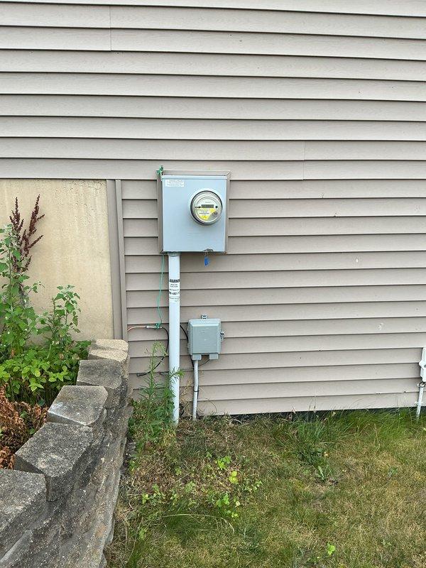Conducted site assessment and provided electrical estimate for installation of dedicated RV power supply circuits. Evaluated existing electrical service panel and exterior meter configuration to determine feasibility of running a 50-amp and 30-amp circuit from the main breaker box to the garage corner for RV connectivity. Documented current panel capacity, available breaker positions, and optimal conduit routing path along exterior siding to proposed receptacle location, ensuring compliance with NEC requirements for RV power outlets and proper circuit protection.
