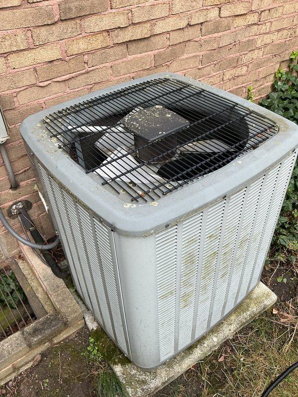 Completed annual cooling maintenance on outdoor condensing unit. Performed comprehensive system inspection, verified proper operation of compressor and condenser fan motor, and confirmed adequate airflow through coil. Noted moderate dust and debris accumulation on condenser coil fins and top discharge grille, which is typical for outdoor equipment. Checked refrigerant lines and electrical connections at unit. Updated customer contact information in system. Unit operating within normal parameters. Documented equipment condition with photos showing 15-year-old system with next recommended maintenance due in 2026.