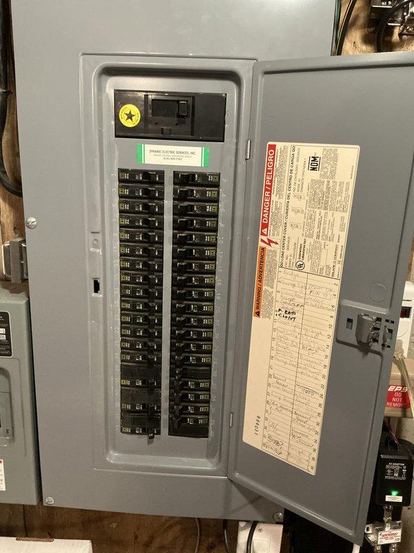 Completed annual air conditioning tune-up and maintenance service on a 12-year-old residential cooling system. Inspected electrical panel and circuit breaker configuration in basement utility area, documented existing electrical infrastructure including main disconnect and circuit distribution, and verified proper electrical supply to HVAC equipment for safe system operation.