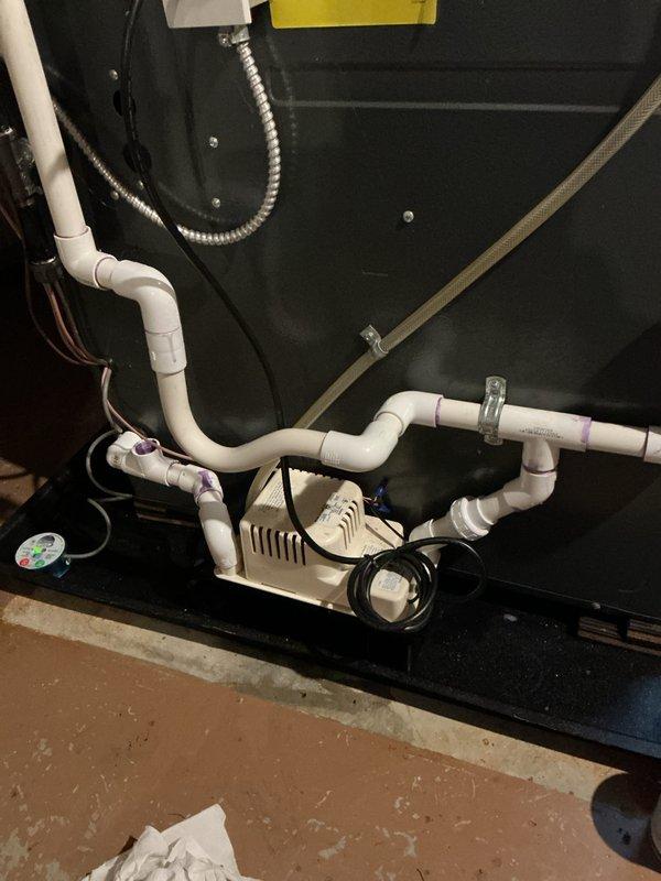 Completed annual cooling maintenance on 2019 system under EnergiAir warranty coverage. Performed comprehensive AC tune-up including system inspection, filter evaluation for 20x25x1 MERV 8 pleated filters, and condensate pump assessment. Inspected condensate drainage system with white PVC piping configuration, verified pump operation and drain pan condition, and documented equipment condition with photos showing proper installation and functionality of all components.