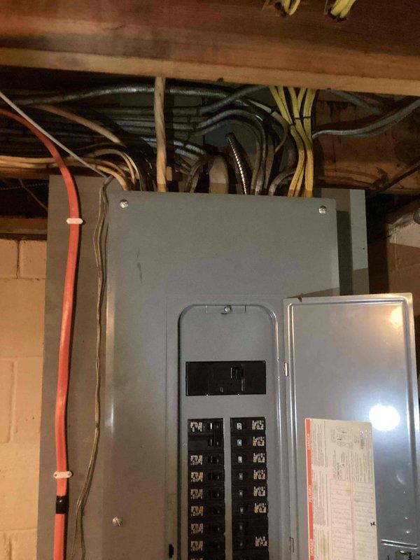 Conducted on-site evaluation for whole-home generator installation at 45-year-old single family residence. Assessed existing 200-amp electrical service with Milbank Type 1A meter enclosure and main distribution panel located in basement utility area. Documented current electrical infrastructure including circuit breaker configuration, service entrance wiring, and available space for transfer switch installation. Photographed meter base with digital Consumers Energy meter and existing panel with adequate clearance for generator tie-in. Evaluated basement access, panel capacity, and electrical load requirements to develop comprehensive installation estimate. Provided customer with detailed quote for generator system including equipment specifications, transfer switch requirements, and installation scope.