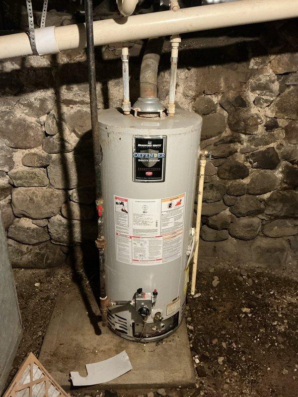 Responded to no hot water complaint on 8-year-old Bradford White Defender Safety System water heater. Upon inspection, diagnosed failed gas control valve preventing burner ignition. Replaced gas control valve, tested unit operation, verified proper ignition sequence and flame characteristics. Unit restored to full heating capacity with all safety systems functioning correctly.