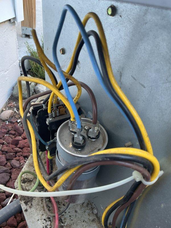 # NC-No Cool Service Completed

Responded to no-cooling complaint on 12-year-old ICP system following recent tune-up. Customer reported outdoor unit humming but not starting. Upon arrival, found compressor attempting to start but failing to run, producing only humming sound indicative of electrical failure.

Performed diagnostic testing on outdoor unit electrical components. Tested capacitor using multimeter and found dual-run capacitor had failed, reading significantly below rated microfarad specifications. Capacitor failure prevented compressor from receiving proper starting boost, causing locked rotor condition and humming noise.

Replaced failed dual-run capacitor with new OEM-equivalent component matching original specifications. Verified all electrical connections at capacitor terminals were secure and properly torqued. Checked contactor operation and confirmed proper voltage supply to unit.

Energized system and verified compressor started successfully without hesitation or abno