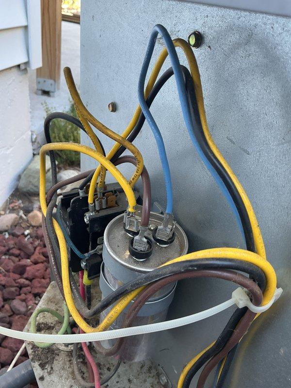 # NC-No Cool Service Completed

Responded to no-cooling complaint on 12-year-old ICP system following recent tune-up. Customer reported outdoor unit humming but not starting. Upon arrival, found compressor attempting to start but failing to run, producing only humming sound indicative of electrical failure.

Performed diagnostic testing on outdoor unit electrical components. Tested capacitor using multimeter and found dual-run capacitor had failed, reading significantly below rated microfarad specifications. Capacitor failure prevented compressor from receiving proper starting boost, causing locked rotor condition and humming noise.

Replaced failed dual-run capacitor with new OEM-equivalent component matching original specifications. Verified all electrical connections at capacitor terminals were secure and properly torqued. Checked contactor operation and confirmed proper voltage supply to unit.

Energized system and verified compressor started successfully without hesitation or abno