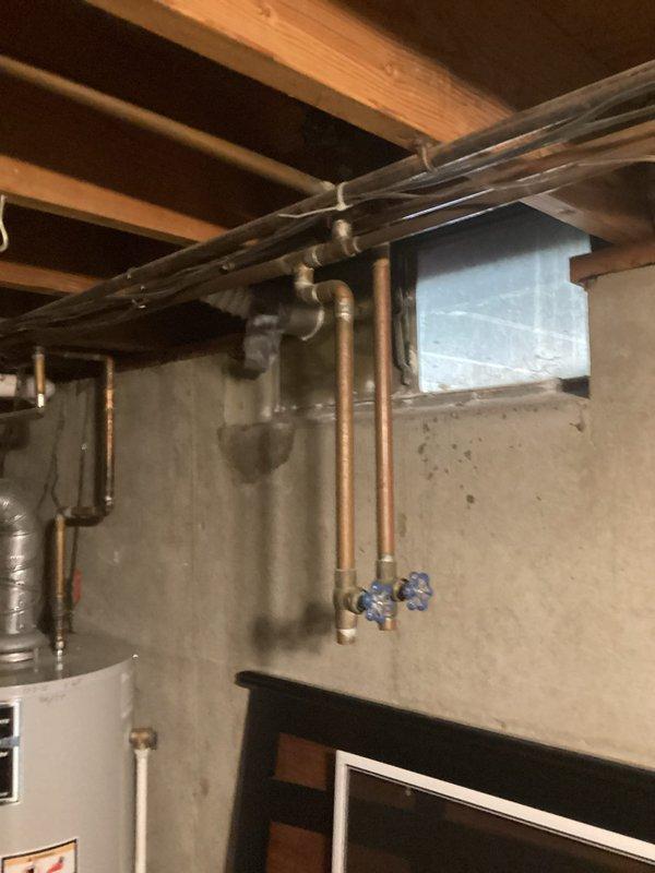 Conducted whole-home water softener installation estimate for a 60-year-old residential property with no existing water conditioning system. Assessed basement plumbing infrastructure, including copper supply lines, valve locations, and available installation space near the utility area. Documented existing plumbing configuration and recommended installation location for new water conditioning equipment.