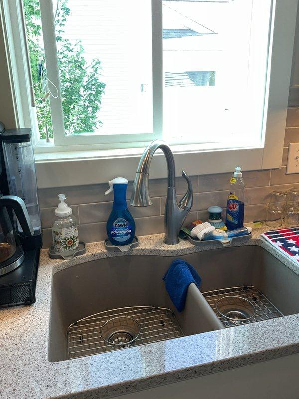 Conducted on-site evaluation for fixture replacement project in 6-year-old residential property. Assessed existing plumbing installations including two toilets, three bathroom faucets, and one kitchen faucet to determine replacement requirements. Inspected kitchen sink area featuring double-basin stainless steel configuration with brushed nickel pull-down faucet and granite countertop. Evaluated bathroom vanity with undermount sink, single-handle brushed nickel faucet, and granite countertop surface. Documented current fixture conditions and verified compatibility requirements for customer-supplied replacement fixtures. Photographed existing installations to reference mounting configurations, supply line connections, and surrounding areas. Confirmed all fixtures are scheduled for standard replacement with no underlying plumbing issues or water damage present. Prepared comprehensive estimate for labor and materials required to remove existing fixtures and install customer-provided repla