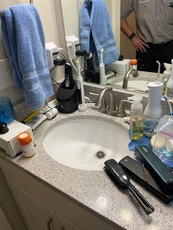 Conducted on-site evaluation for fixture replacement project in 6-year-old residential property. Assessed existing plumbing installations including two toilets, three bathroom faucets, and one kitchen faucet to determine replacement requirements. Inspected kitchen sink area featuring double-basin stainless steel configuration with brushed nickel pull-down faucet and granite countertop. Evaluated bathroom vanity with undermount sink, single-handle brushed nickel faucet, and granite countertop surface. Documented current fixture conditions and verified compatibility requirements for customer-supplied replacement fixtures. Photographed existing installations to reference mounting configurations, supply line connections, and surrounding areas. Confirmed all fixtures are scheduled for standard replacement with no underlying plumbing issues or water damage present. Prepared comprehensive estimate for labor and materials required to remove existing fixtures and install customer-provided repla