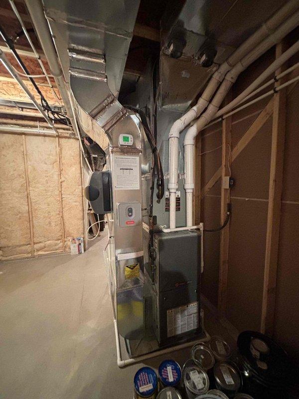 Responded to no-cool call on 6-year-old Trane system. Customer reported outdoor unit rattling prior to shutting system off at thermostat, and unit would not restart. Upon arrival, performed system diagnostic and inspection of both indoor and outdoor equipment. Verified thermostat operation and checked electrical connections. Inspected outdoor unit for mechanical issues related to reported rattling noise. Identified and resolved issue preventing system from responding to thermostat commands. Tested system operation and confirmed proper cooling cycle restored with no abnormal sounds from outdoor unit.