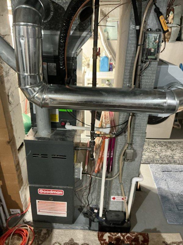 Completed annual cooling maintenance on residential HVAC system. Performed comprehensive inspection of Goodman furnace and air handler assembly located in basement mechanical room, checking all electrical connections, refrigerant lines, and ductwork components. Inspected attic-mounted evaporator coil assembly, verified proper condensate drainage system operation, confirmed airflow direction indicators, and assessed drain pan for leaks. All components operating within normal parameters; system ready for cooling season under existing warranty coverage through 2026.