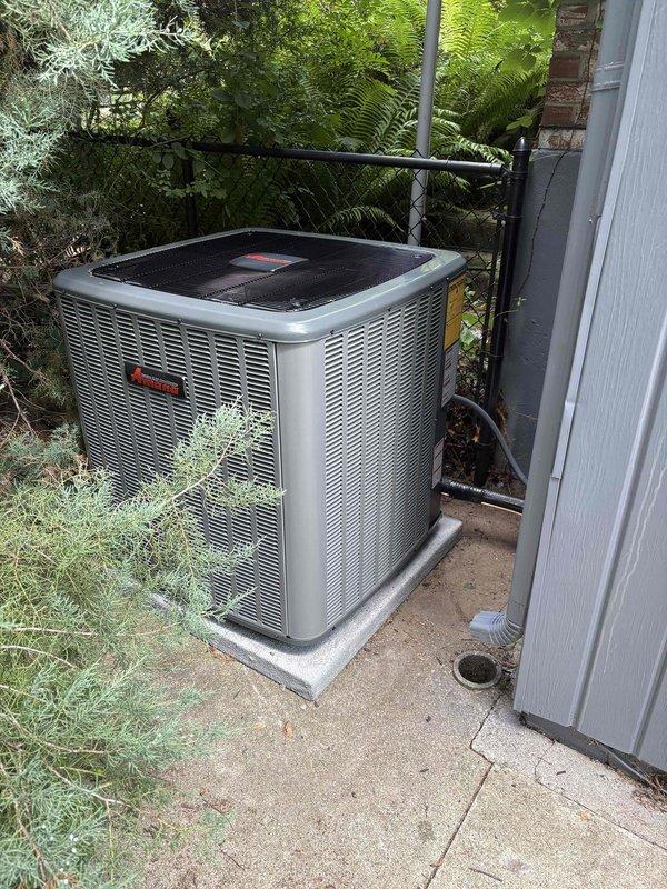 Completed full HVAC system replacement including installation of new air handler unit in basement utility area and outdoor condensing unit. Air handler was mounted vertically against interior wall framing with proper PVC condensate drain lines and ventilation piping installed. Connected flexible ductwork and metallic supply/return ductwork to new air handler. Outdoor condenser unit was positioned on concrete pad in side yard with appropriate clearance for airflow and service access. Refrigerant lines were properly routed and secured along exterior wall connecting indoor and outdoor components. All electrical connections completed per manufacturer specifications. System was pressure tested, evacuated, charged with refrigerant, and commissioned. Verified proper operation of all components including airflow, temperature differential, and drainage system functionality.