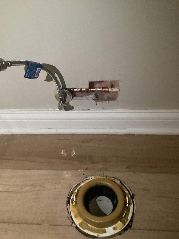 Responded to service call for newly installed toilet with active leak requiring water shutoff. Upon inspection, identified leak source at water supply connection. Removed and reinstalled supply line with proper plumber's tape application to threaded connections. Verified all mounting hardware was properly secured and toilet was level. Restored water supply and tested system under full pressure to confirm leak was resolved and all connections remained dry.