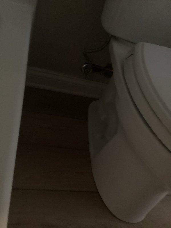 Responded to service call for newly installed toilet with active leak requiring water shutoff. Upon inspection, identified leak source at water supply connection. Removed and reinstalled supply line with proper plumber's tape application to threaded connections. Verified all mounting hardware was properly secured and toilet was level. Restored water supply and tested system under full pressure to confirm leak was resolved and all connections remained dry.