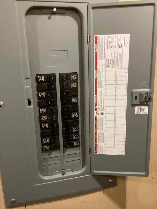 Provided estimate for replacement of 28-year-old 1998 Lennox 5-ton packaged cooling-only unit utilizing R-22 refrigerant, which was deemed non-repairable by previous technician. Documented existing electrical panel and breaker configuration in basement utility area to assess compatibility with replacement equipment. Unit connects through exterior wall to existing ductwork; home utilizes separate boiler and baseboard heating system that will remain unchanged.