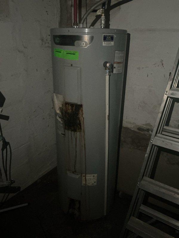 Performed comprehensive plumbing inspection for pre-sale home evaluation. Inspected all accessible plumbing systems and fixtures throughout property to verify proper operation and identify any issues requiring attention before listing.

During inspection, discovered A.O. Smith 100-gallon water heater with significant rust and corrosion damage at base of tank, indicating potential tank failure and active deterioration. Dark brown to orange discoloration and staining extended vertically from floor level upward on lower front section of unit. Documented condition with photographs showing extent of corrosion damage and overall water heater installation. Inspected all water supply connections, piping, and shutoff valves at top of unit. Verified proper venting and electrical connections to water heater.

Advised that water heater exhibits signs of advanced deterioration requiring replacement prior to sale to avoid complications during home inspection process. Provided documentation of findin