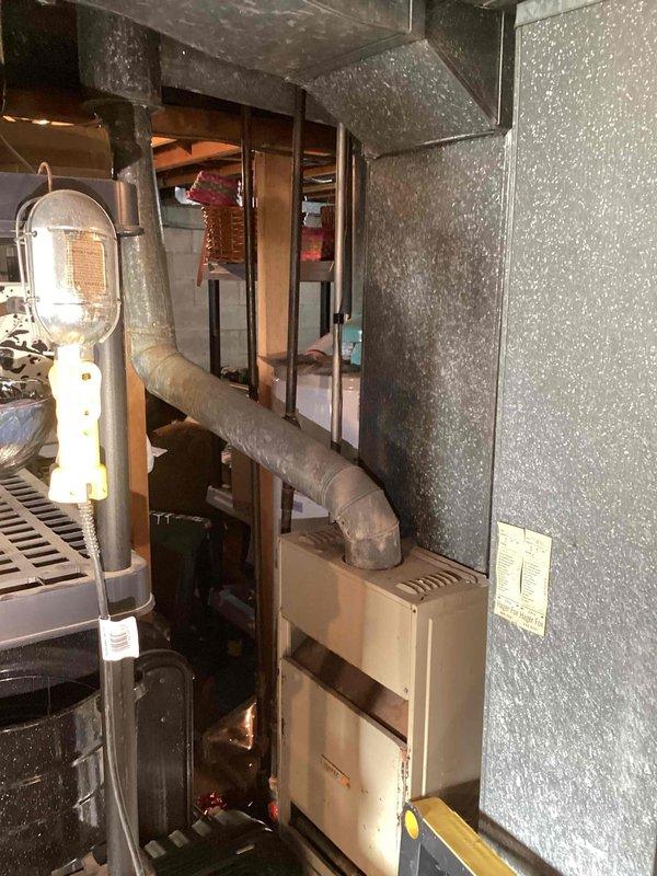 Conducted site assessment for tankless water heater installation in 1967-constructed residence. Evaluated existing plumbing infrastructure, including exposed pipe routing through attic space and utility area mechanical systems. Documented current HVAC equipment placement, ductwork configuration, and available utility connections to determine optimal location and requirements for on-demand water heater installation.