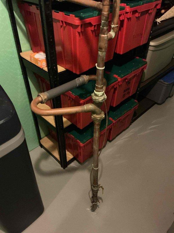 Provided estimate for water heater replacement at single family residence. Current water heater is operational with no leaks or performance issues reported. Documented existing plumbing configuration including copper and galvanized pipe connections in basement installation area.
