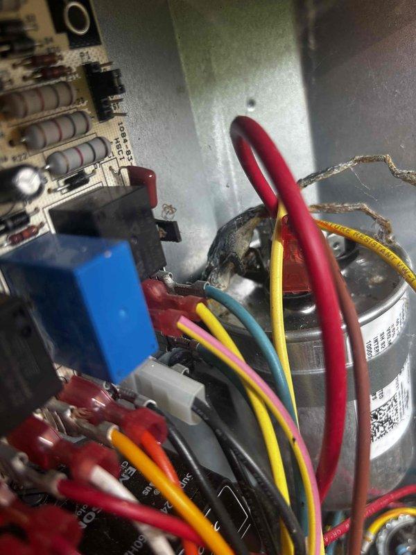 Completed annual cooling system tune-up and inspection. Documented deteriorated insulation on refrigerant line set requiring attention, with foam insulation showing significant weathering and separation at exterior wall penetration. Inspected electrical control board and capacitor connections, verifying all wire terminations and component conditions within acceptable parameters.