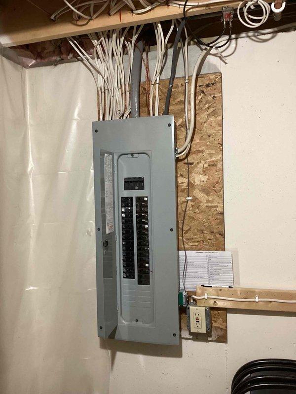 Completed on-site evaluation for mini split system installation in three-season porch area of single-family residence with no existing cooling system. Assessed electrical panel capacity and routing options in basement, confirmed adequate power availability for new equipment. Evaluated installation location in finished porch space, documented ceiling configuration with drop tiles and lighting, identified optimal placement for indoor air handler unit and determined exterior wall access for refrigerant line set and condensate drain routing to outdoor condenser location.