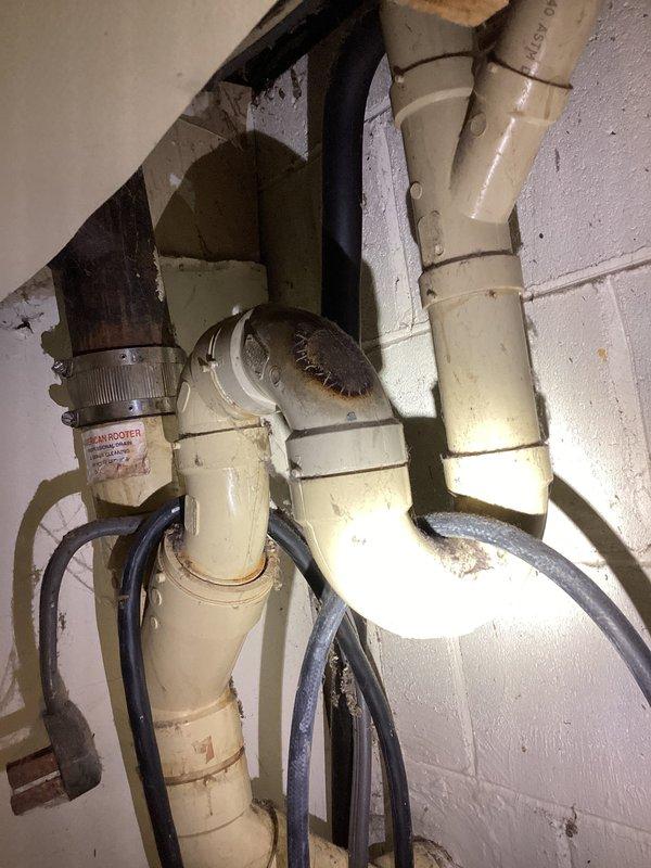 Responded to a bathroom sink drain clog causing extremely slow drainage. Accessed plumbing system through crawl space and inspected the drainage assembly, including PVC piping configuration and associated mechanical components. Successfully cleared the obstruction and restored proper drainage flow to the fixture.