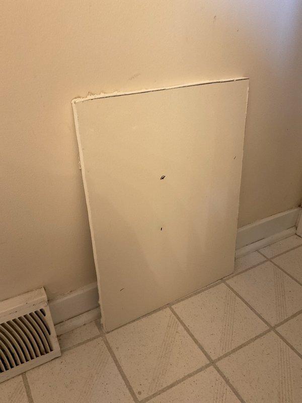 Completed bathroom drywall access panel repairs including removal of damaged section, preparation of opening, and installation of new access panel with proper finishing. Replaced worn drywall material and ensured flush mounting with existing wall surface for seamless integration with surrounding tile work.