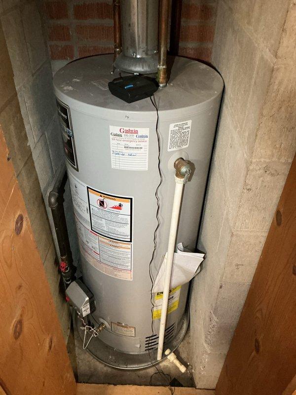 Completed comprehensive water heater tune-up on 15+ year old Grelein unit located in basement utility area. Performed standard maintenance inspection including testing temperature and pressure relief valve, checking all plumbing connections and copper piping for leaks or corrosion, inspecting the galvanized steel sections and fittings, verifying proper operation of shut-off valves, and examining discharge pipe installation. All components found to be functioning properly with no immediate repairs required at this time.