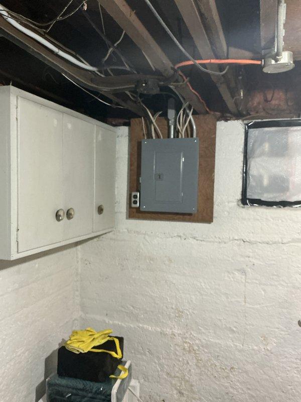 Conducted on-site evaluation for furnace and air conditioning system replacement in residential basement utility room. Assessed existing gray metal HVAC unit, including current ductwork configuration with horizontal metallic supply duct and white PVC condensate piping. Documented equipment placement, clearances, and surrounding infrastructure including electrical panel location and available service access. Evaluated structural considerations with exposed ceiling joists and existing utility routing for new system installation planning. Provided comprehensive estimate for complete furnace and AC replacement based on current equipment specifications and installation requirements.