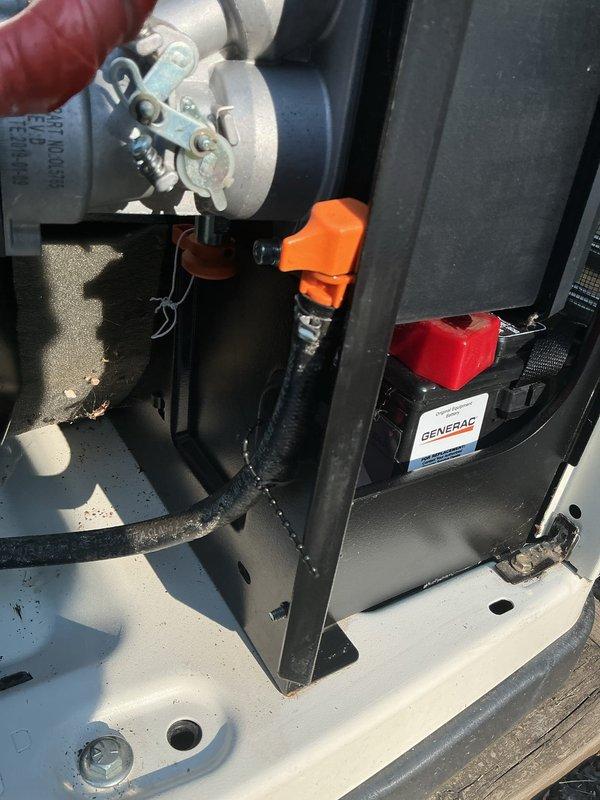 Completed annual generator tune-up on 7-year-old Generac unit per authorized maintenance schedule. Performed comprehensive inspection of all mechanical components including engine assembly, fuel system connections, and mounting hardware. Inspected flexible fuel line connectors with metal clamps, brass fittings, and corrugated protective sleeves for proper installation and condition. Verified secure mounting of all equipment to rooftop platform, checked cabinet housing integrity, and confirmed all bolts and brackets were properly torqued. All components found in good operational condition with no signs of deterioration or required repairs. Unit tested and operating within manufacturer specifications.